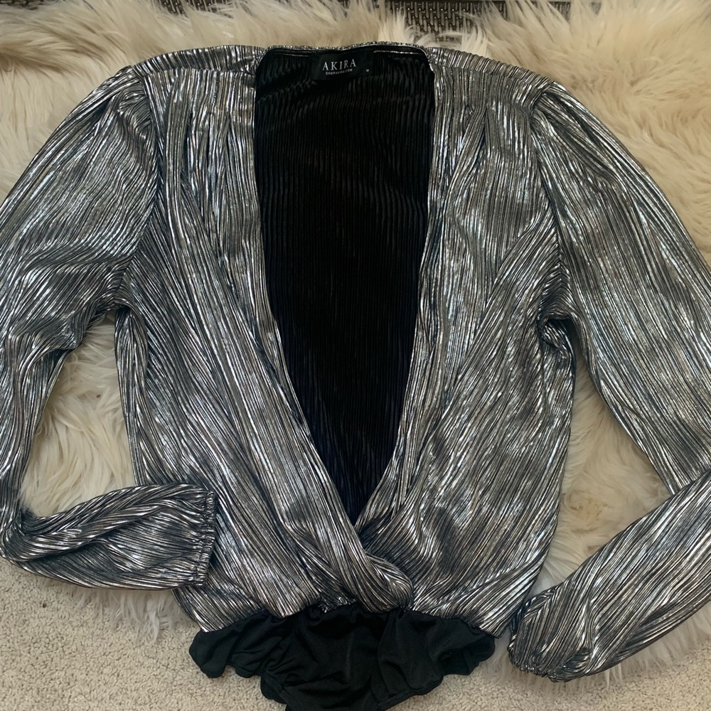 Silver bodysuit with plunging neckline